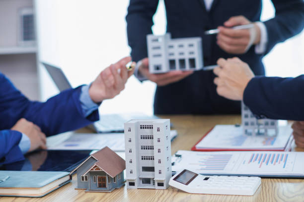 Real estate agent showing property to clients